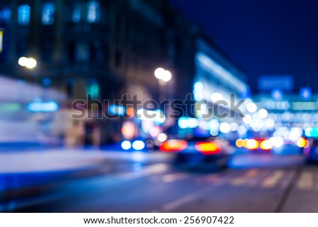 Nights lights of the big city, moving cars. In blue tones