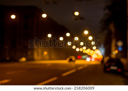 Nights lights of the big city, the night avenue with lanterns over it