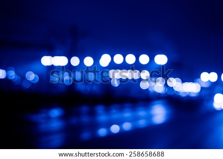 Night industrial city, lights of the railroad. Image in the blue toning