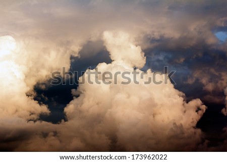 Beautiful, dramatic, colorful clouds and sky. Image has grain texture seen at 100 percent of its size.
