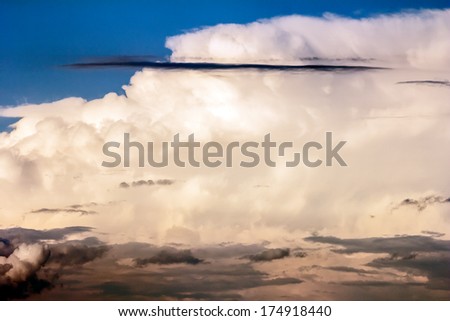 Beautiful, dramatic, colorful clouds and sky. Image has grain texture seen at 100 percent of its size.