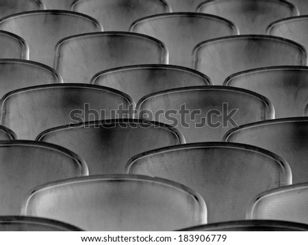 Black and white, abstract composition, background and texture from backrest of the seats and seats outdoors