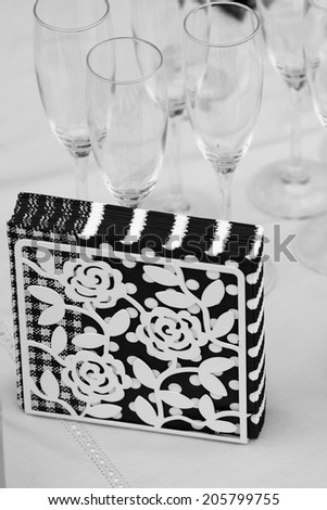 Black and white table arrangement with napkins and glasses