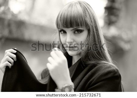 Black and white portrait of a beautiful, caucasian, young, long haired woman posing in urban locations