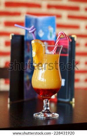 Campari orange drink at the bar with bar design in the background