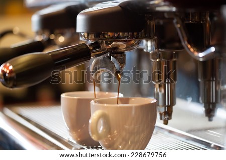 Espresso machine working with bar interior background