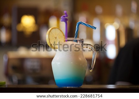 Cup of lemonade with bar interior background