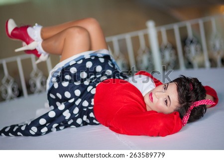 Photo session of an expressive,short haired brunette woman on the floor