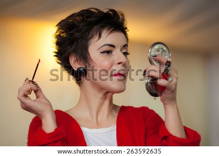 Photo session of an expressive,short haired, brunette woman during the makeup session