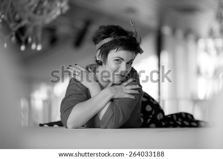 Photo session of an expressive,short haired, brunette woman. Black and white photography