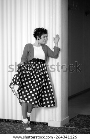 Photo session of an expressive, short haired, brunette woman. Black and white photography
