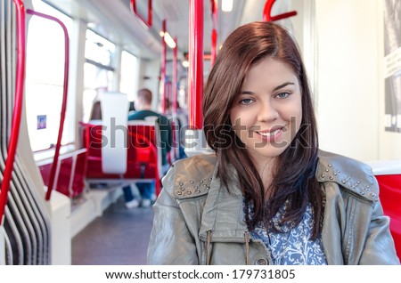 Young woman traveling by public transport