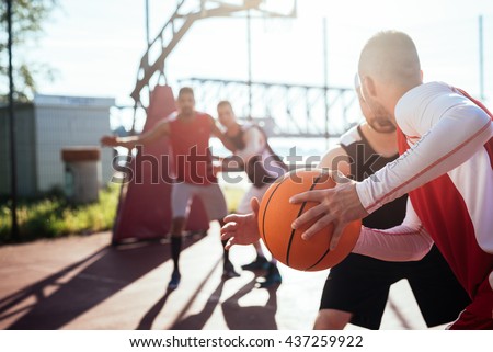 Man passing the ball to another player.