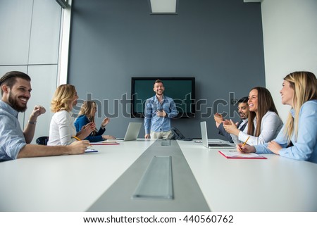 Man presenting ideas to the rest of the team.