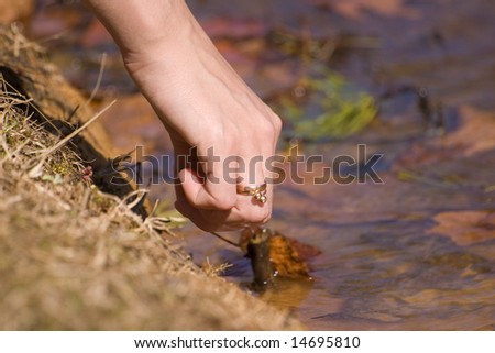 Women\'s hand plays with water