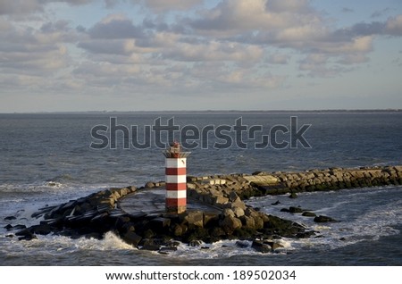 Light beacon at the entrance of IJmuiden harbour, The Netherlands, entrance to the port of Amsterdam