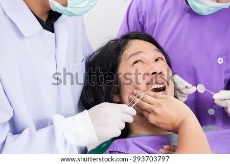 Man suffering from toothache, Man frightened dentists covers her mouth