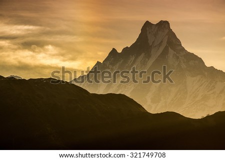 Himalayan mountain peak during sunrise ( Machapuchare or Fishtail peak in Nepal )