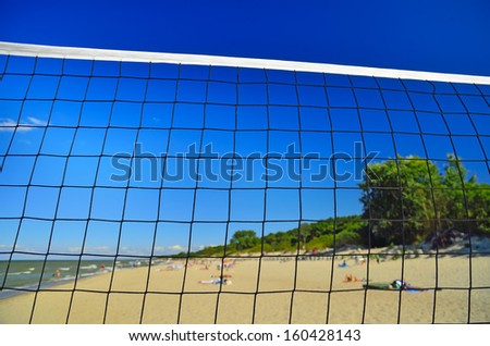 Net for beach volleyball closeup on the gold beach