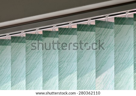 Vertical blinds on the window of the office