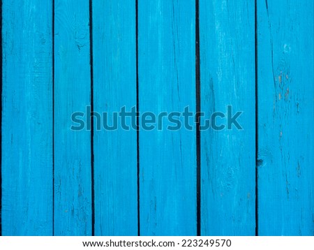 Wooden fence blue background