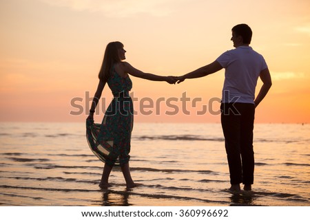 loving couple on the coast, people\'s attitudes. love story. Loving couple dancing on the coast.