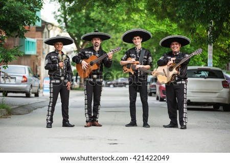 Mexican, Latin American, Spanish. Musicians on the streets.
