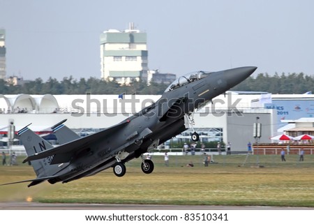 ZHUKOVSKY, RUSSIA - AUG 16: An F-15 jet fighter flying at an airshow  at International aviation and space salon MAKS 2011 on August 16, 2011 in Zhukovsky, Russia