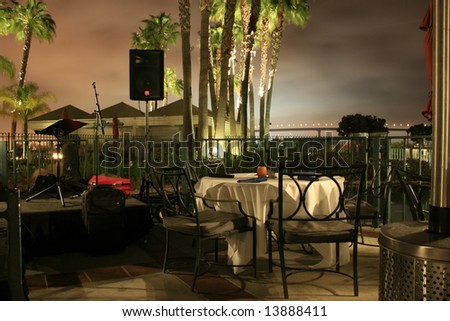 Tables and chairs in restaurant at night time