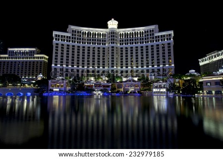 Las Vegas, Nevada, USA - Sept. 25, 2014: Buildings at the Bellagio casino and hotel reflecting in the fountain lake a night along the Las Vegas Blvd in Las Vegas, Nevada, USA on Sept. 25, 2014