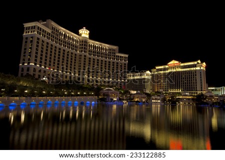 Las Vegas, Nevada, USA - Sept. 25, 2014: Buildings at the Bellagio casino and hotel reflecting in the fountain lake a night along the Las Vegas Blvd in Las Vegas, Nevada, USA on Sept. 25, 2014