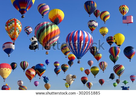 Whitehouse Station, New Jersey, USA - July 24, 2015: Mass ascension launch of over 100  hot air balloons at the New Jersey Ballooning Festival in Whitehouse Station, New Jersey on July 24, 2015.