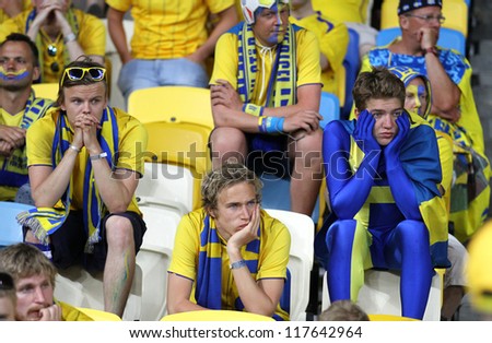 KYIV, UKRAINE - JUNE 15: Swedish soccer fans react after England beat of Sweden in their UEFA EURO 2012 game on June 15, 2012 in Kyiv, Ukraine
