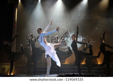 KYIV, UKRAINE - DECEMBER 17: Hanna Bessonova (in White) and other artistic gymnasts dance during the concert timed to Jacques Rogge\'s official visit to Ukraine on December 17, 2010 in Kyiv, Ukraine