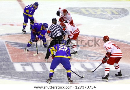 KYIV, UKRAINE - NOVEMBER 11: Referee face-off the rink during ice-hockey pre-olympic qualification game between Ukraine in Poland on November 11, 2012 in Kyiv, Ukraine