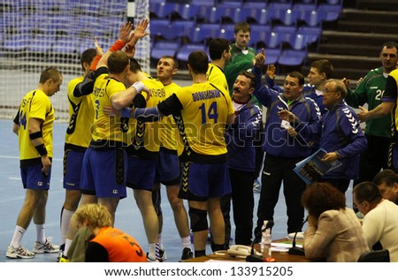KYIV, UKRAINE - APRIL 2: Ukrainian handball players celebrate after win against Netherlands in qualification for handball EHF EURO 2014 on April 2, 2013 in Kyiv, Ukraine
