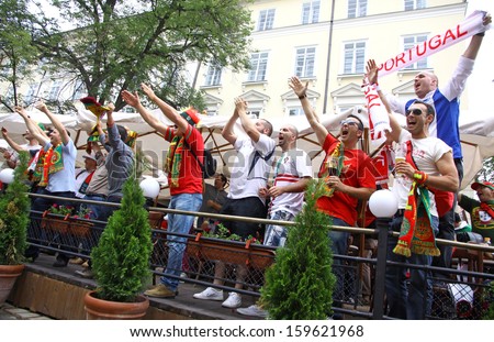 LVIV, UKRAINE - 9 JUNE: Portugal football team supporters walk on a streets of Lviv city before UEFA EURO 2012 game against Germany on 9 June, 2012 in Lviv, Ukraine