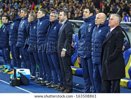 KYIV, UKRAINE - NOVEMBER 15: Head coach Didier Deschamps and other France football team coaches listen national anthem before FIFA World Cup 2014 qualifier game against Ukraine on Nov.15, 2013 in Kyiv