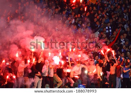 KYIV, UKRAINE - APRIL 16, 2014: FC Dynamo Kyiv ultras (ultra supporters) burn flares during Ukraine Championship game against Shakhtar Donetsk at NSC Olimpiyskiy stadium in Kyiv