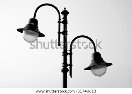 The couple of lamps on the lamppost, black/white