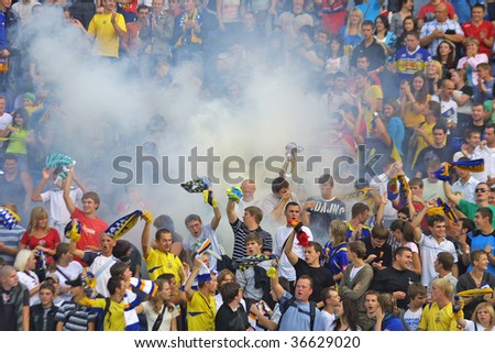 KYIV, UKRAINE - SEPTEMBER 05: Ukraine National Football team supporters burn the fires and react after scored against Andorra during 2010 FIFA World Cup qualifiers match  on September 5, 2009 in Kyiv