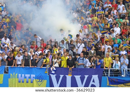 KYIV, UKRAINE - SEPTEMBER 05: Ukraine National Football team supporters burn the fires and react after scored against Andorra during 2010 FIFA World Cup qualifiers match on September 5, 2009 in Kyiv