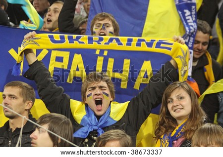 DNIPROPETROVSK, UKRAINE - OCTOBER 10: Ukrainian fans react after Ukraine beat of England in their World Cup 2010 qualifying football match at the Dnipro Arena on October 10, 2009 in Dnipropetrovsk