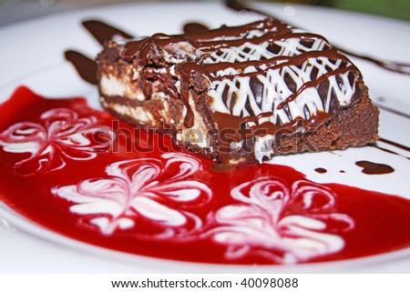 Chocolate roll with cherry jam dessert