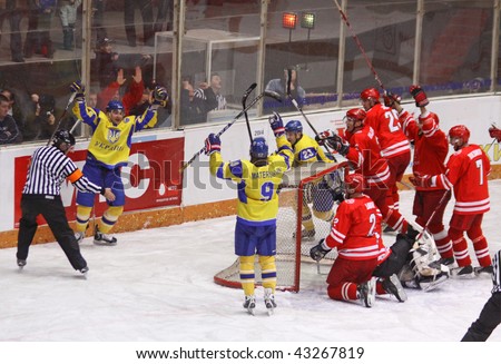 KYIV, UKRAINE - DECEMBER 19: Dmytro Tsyrul (second from L) of Ukraine reacts after he scored a goal during exhibition game against Poland on December 19, 2009 in Kyiv, Ukraine