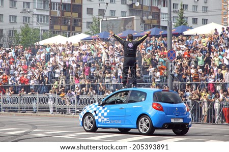 KYIV, UKRAINE - MAY 19, 2012: Unknown driver performs at Renault Clio during Red Bull Champions Parade on the streets of Kyiv city