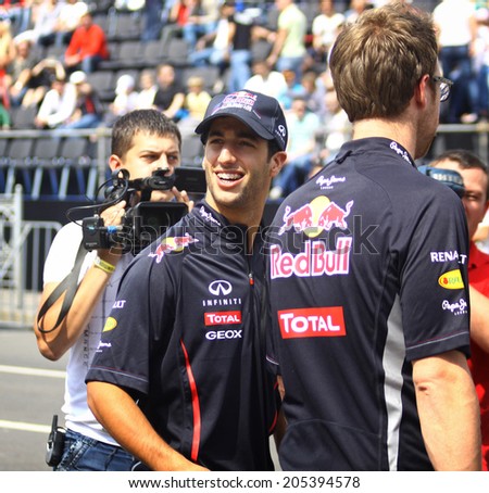 KYIV, UKRAINE - MAY 19, 2012: Driver Daniel Ricciardo of Red Bull Racing Team looks on during Red Bull Champions Parade on the streets of Kyiv city