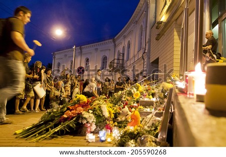 KYIV, UKRAINE - JULY 17, 2014: People place flowers at Dutch embassy in Kyiv after Malaysia Airlines Boeing 777 originating in Amsterdam crashed in Eastern Ukraine