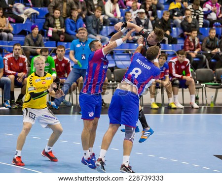 KYIV, UKRAINE - OCTOBER 18, 2014: Motor handball players (in red-blue) play the match of European Handball Champions League against Aalborg