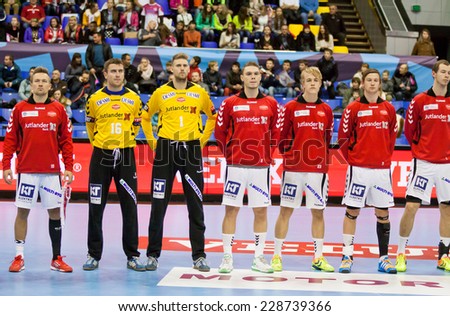 KYIV, UKRAINE - OCTOBER 18, 2014: Handball players of Aalborg team listen the anthem before European Handball Champions League game against Motor